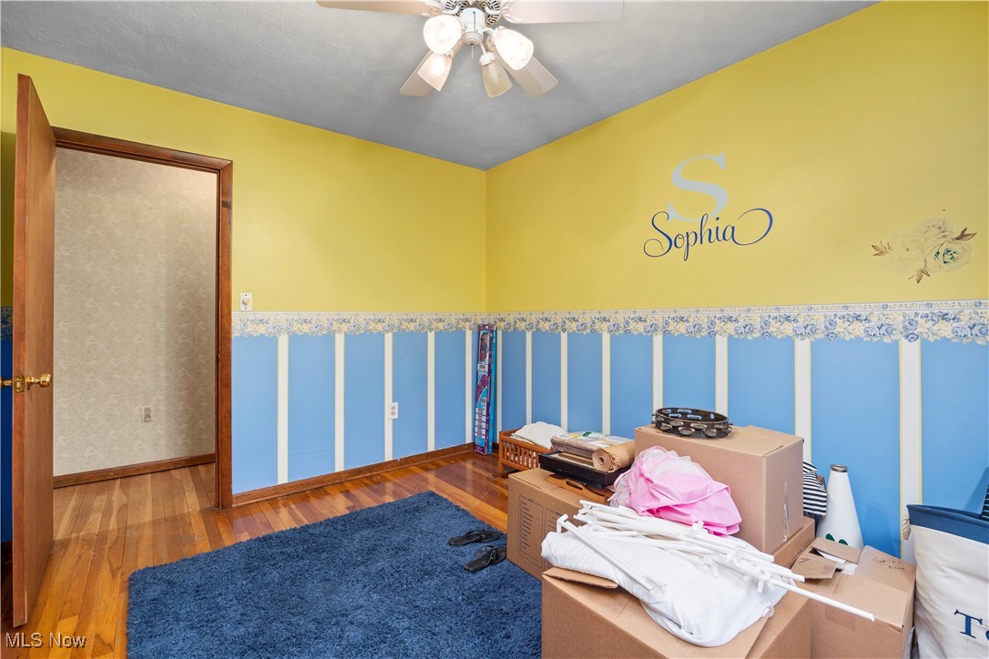 11811 Robson Road Grafton, OH 44044 - Photo 27 of 50 Bedroom featuring wood finished floors, ceiling fan, and baseboards