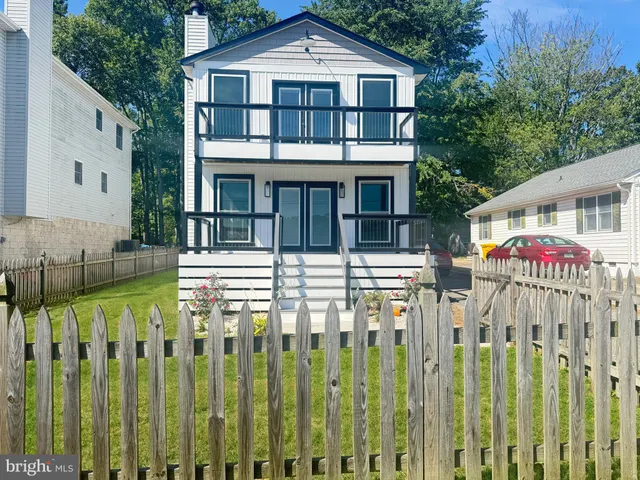a front view of a house with a porch
