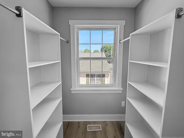 a view of an empty walk in closet
