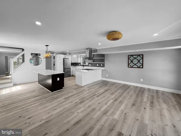 a kitchen with granite countertop a stove and cabinets