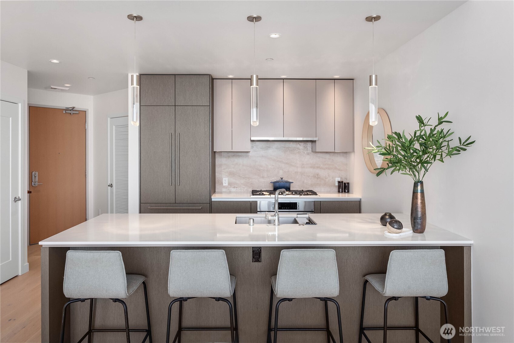 2510 6th Avenue, Unit 3801 Seattle, WA 98121 - Photo 14 of 40 a kitchen with granite countertop a sink and white cabinets