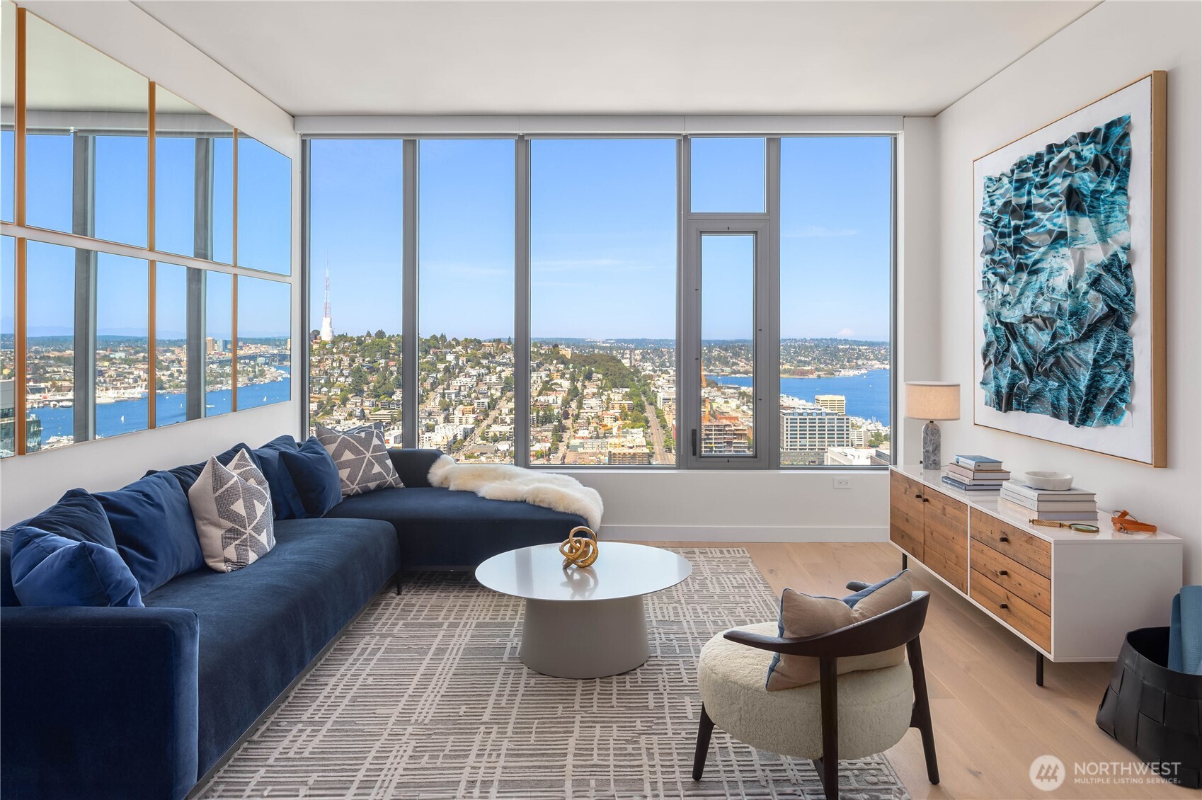 2510 6th Avenue, Unit 3801 Seattle, WA 98121 - Photo 7 of 40 a living room with furniture and a large window