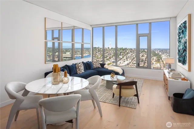a living room with furniture and a large window