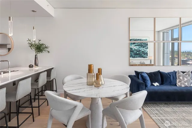 a view of a dining room with furniture and window