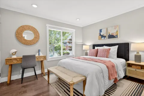 a bed room with a bed and a chair