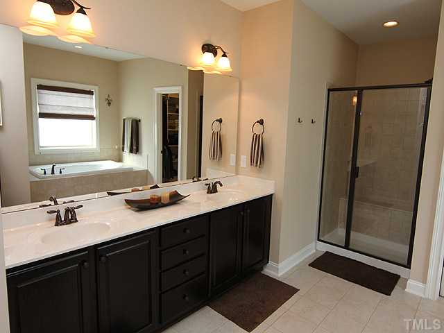 12924 Edsel Drive Raleigh, NC 27613 - Photo 13 of 25 His and hers sinks, soaking tub, separate tiled shower. Luxury! Again, please note oil rubbed bronze finish that is featured through out this gorgeous home.