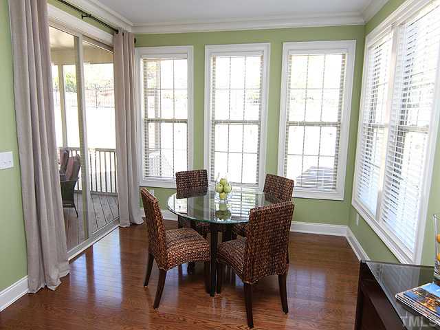 12924 Edsel Drive Raleigh, NC 27613 - Photo 6 of 25 You may not want to leave this area! Breakfast nook surrounding by windows and overlooking the screened porch and spacious yard. Great place to enjoy your morning tea or coffee.