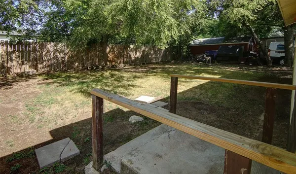 a view of swimming pool with a yard