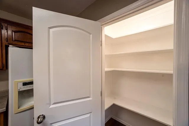 a view of an empty walk in closet