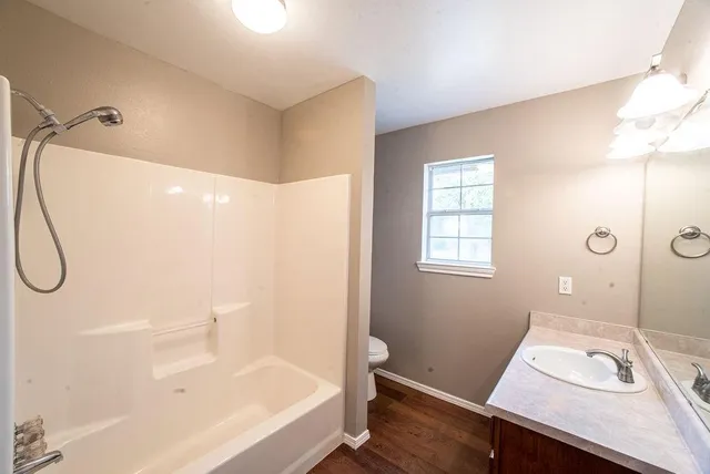 a bathroom with a bathtub and shower