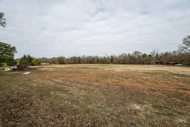 a view of a lake with houses in the back
