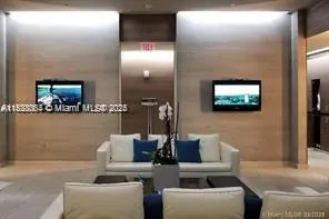 a large white bed in a white room