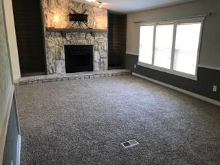 305 North Centerpoint Road Portland, TN 37148 - Photo 15 of 18 a view of an empty room with a fireplace and a window