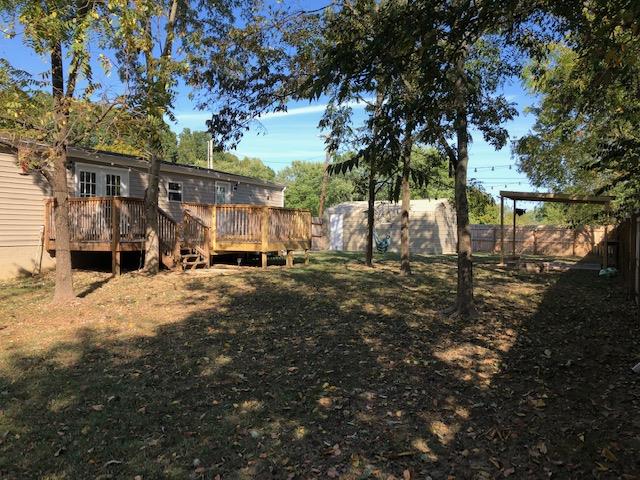 305 North Centerpoint Road Portland, TN 37148 - Photo 4 of 18 a view of a yard with wooden fence