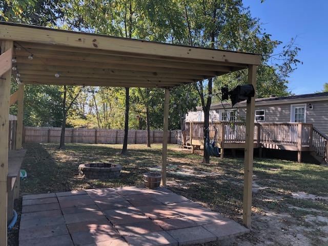 305 North Centerpoint Road Portland, TN 37148 - Photo 6 of 18 a view of a backyard with wooden fence
