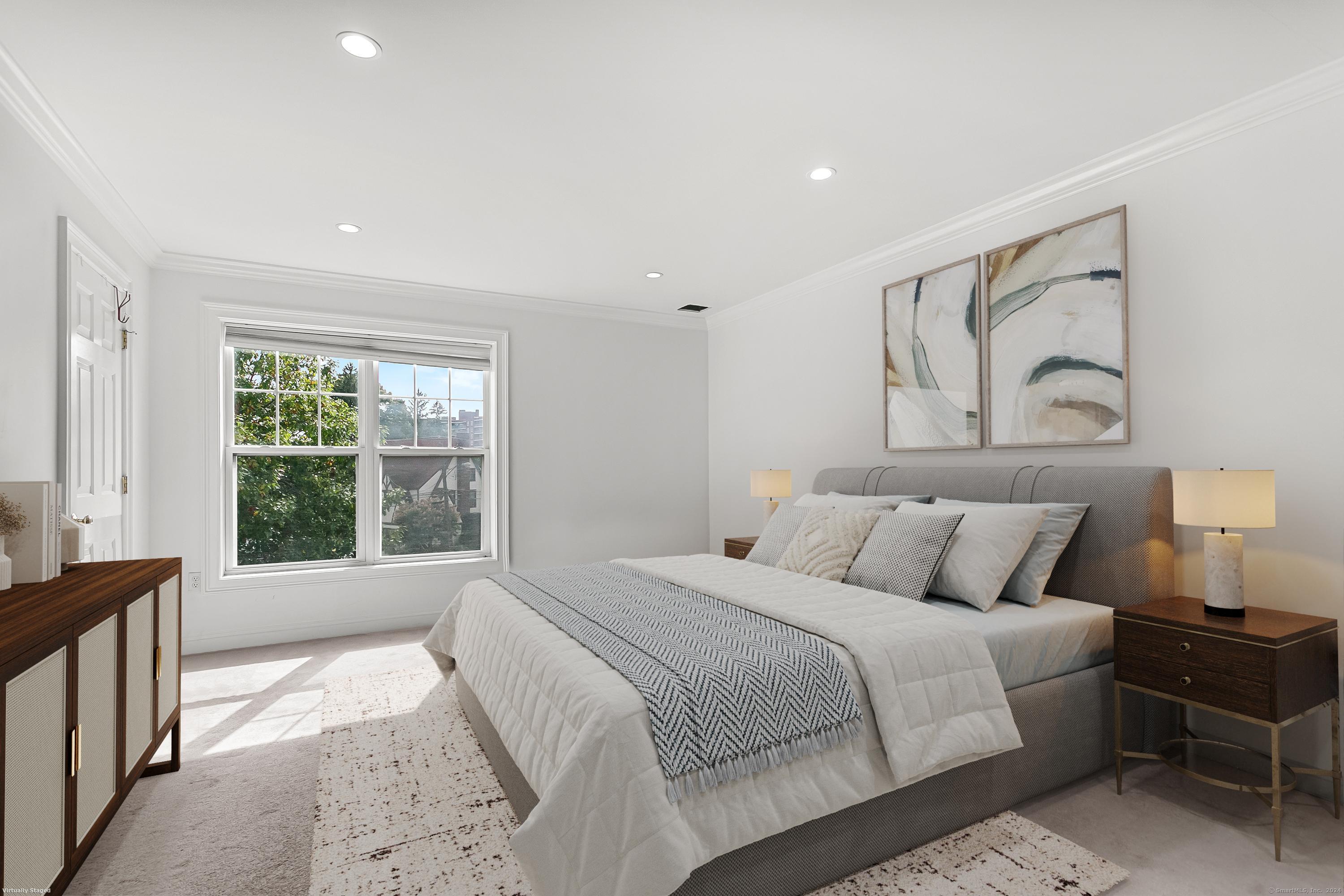 28 Rock Spring Road, Unit B2 Stamford, CT 06906 - Photo 16 of 32 a bedroom with a large bed and a large window