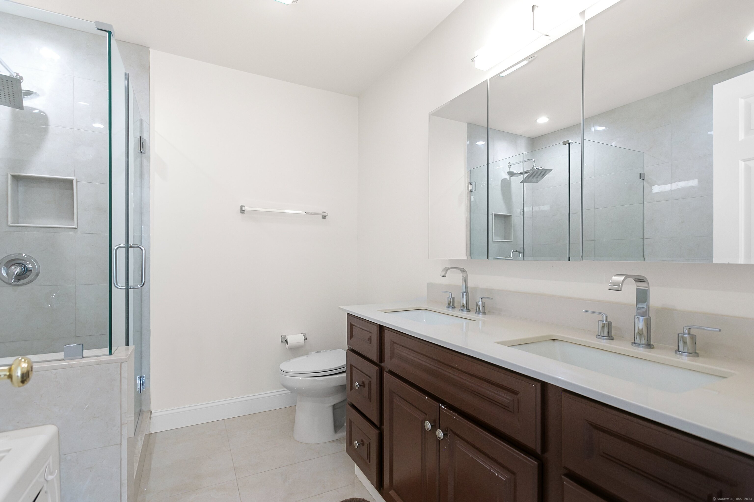 28 Rock Spring Road, Unit B2 Stamford, CT 06906 - Photo 20 of 32 a bathroom with a sink a toilet a shower and a mirror