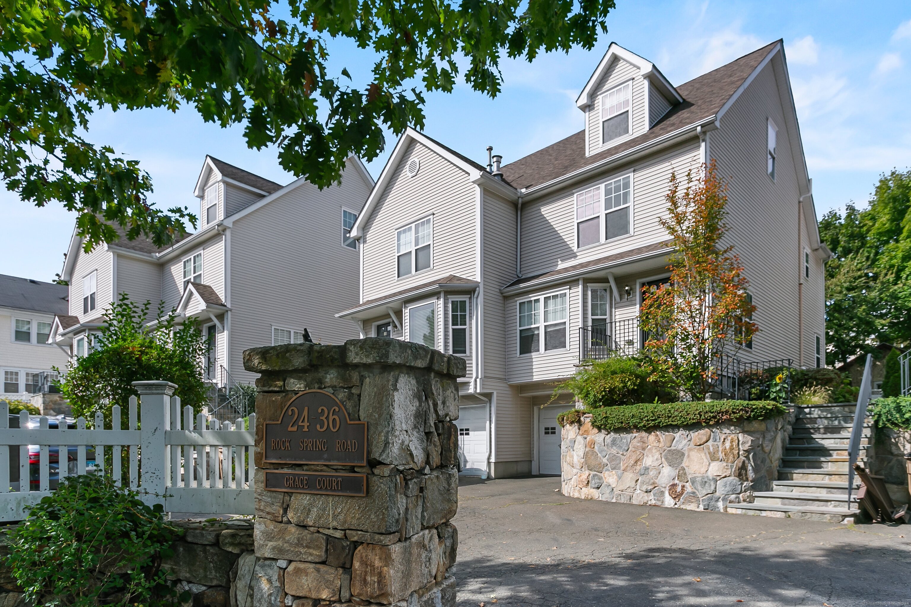 28 Rock Spring Road, Unit B2 Stamford, CT 06906 - Photo 2 of 32 a front view of a house with garden