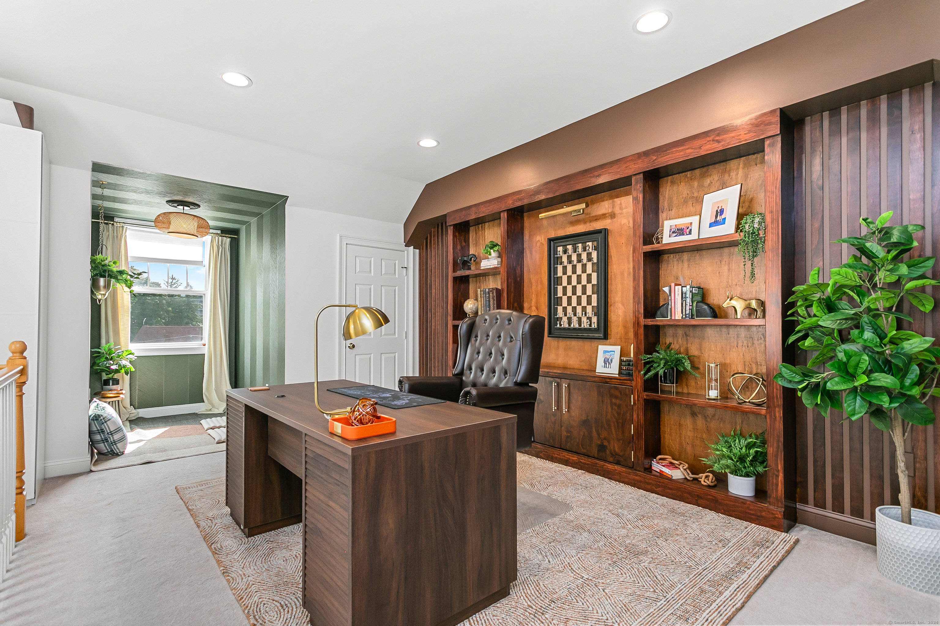 28 Rock Spring Road, Unit B2 Stamford, CT 06906 - Photo 22 of 32 a living room with furniture a potted plant and open kitchen view