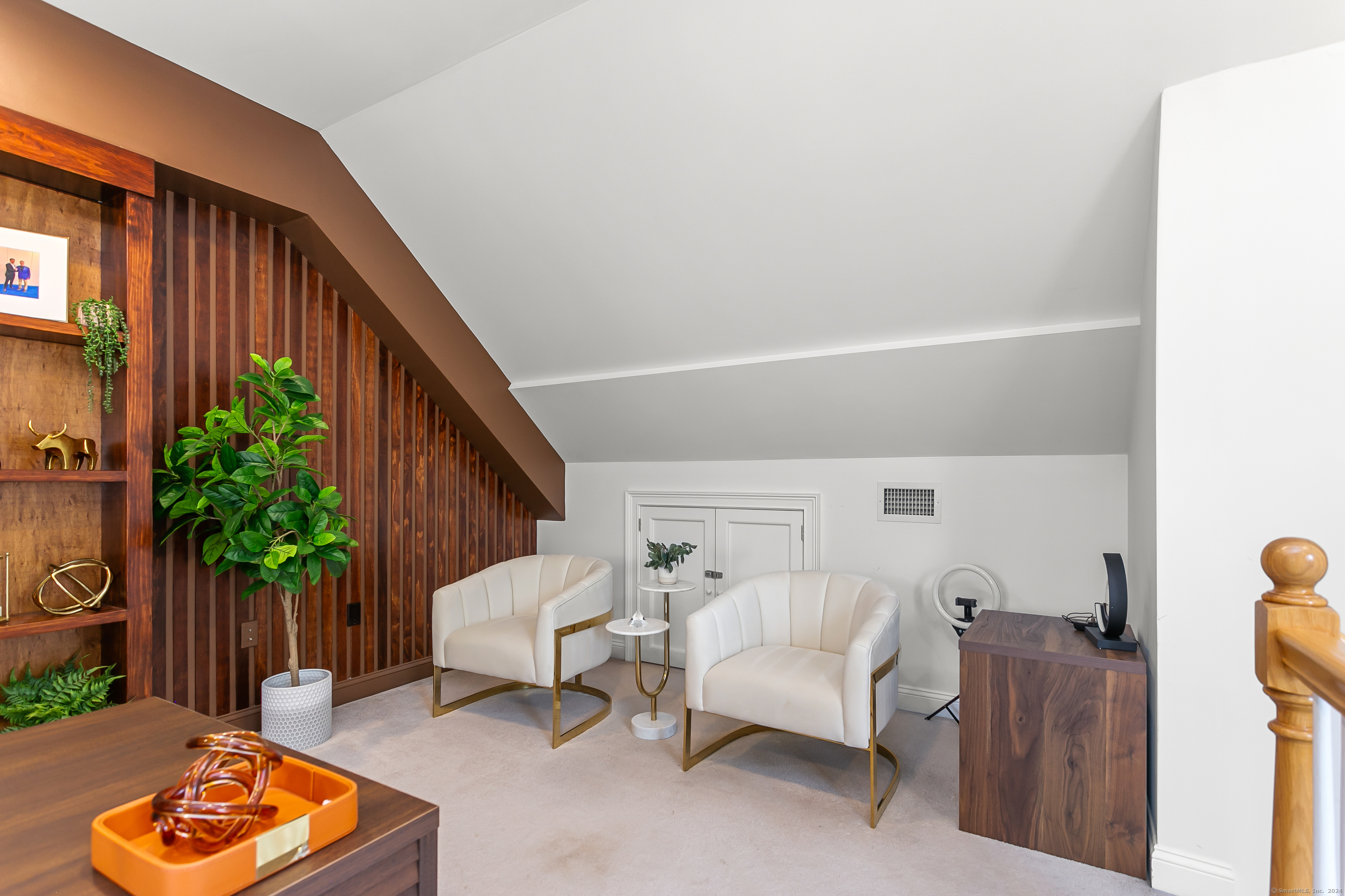 28 Rock Spring Road, Unit B2 Stamford, CT 06906 - Photo 25 of 32 a bedroom with furniture and a potted plant