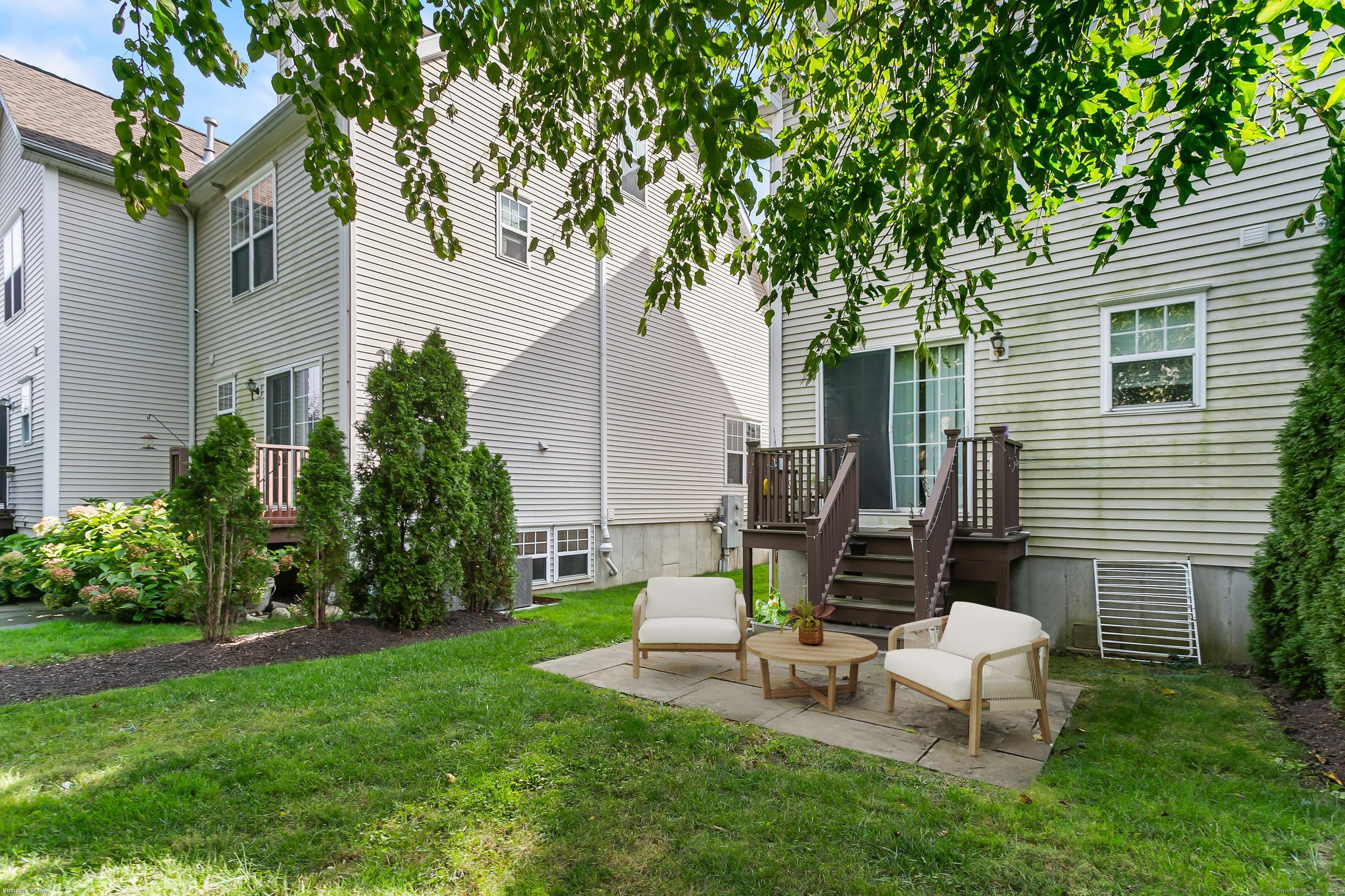 28 Rock Spring Road, Unit B2 Stamford, CT 06906 - Photo 31 of 32 a view of a house with backyard and sitting area