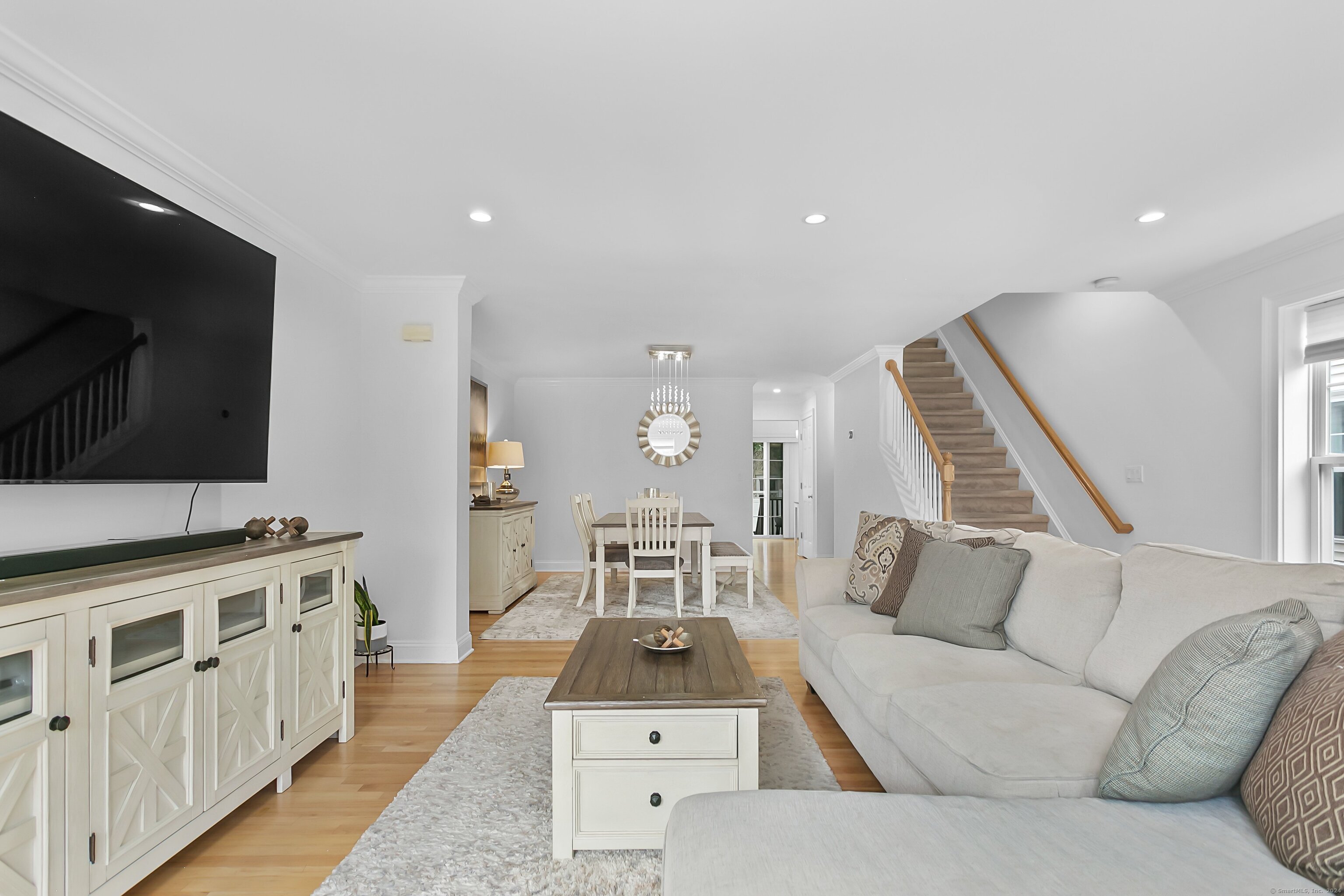 28 Rock Spring Road, Unit B2 Stamford, CT 06906 - Photo 4 of 32 a living room with furniture and a flat screen tv