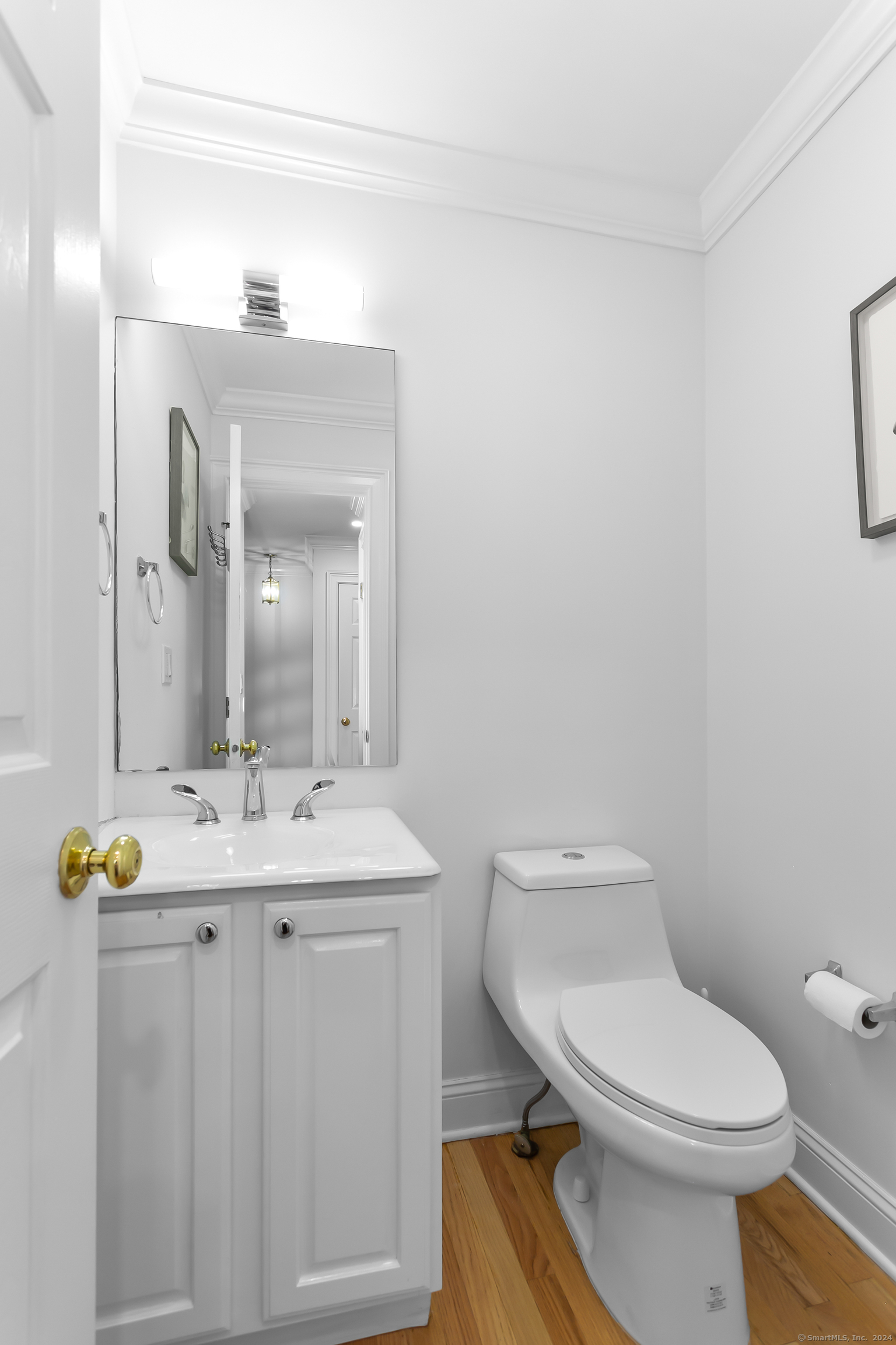 28 Rock Spring Road, Unit B2 Stamford, CT 06906 - Photo 8 of 32 a bathroom with a toilet a sink and mirror