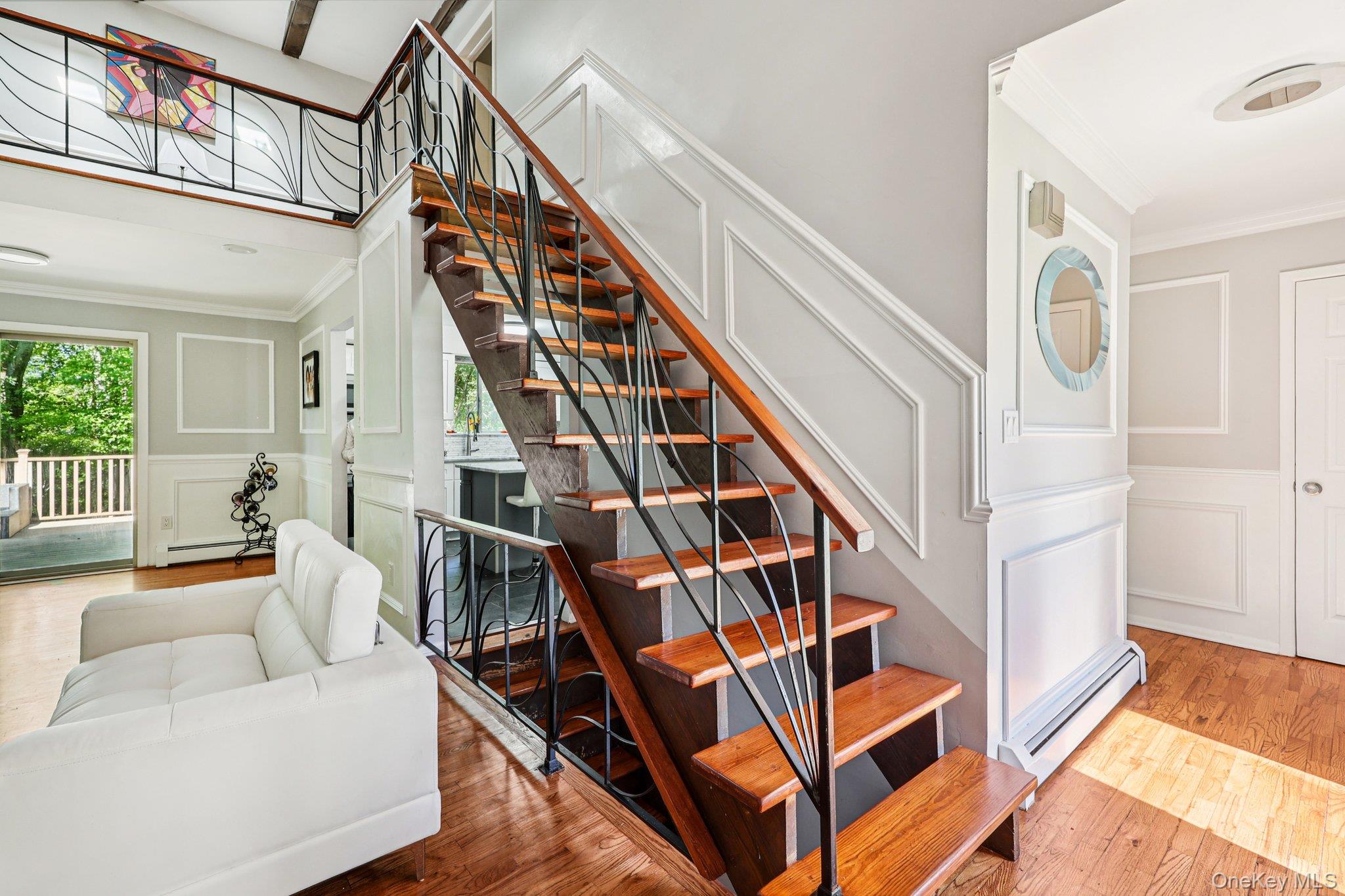 9 Crane Road Middletown, NY 10941 - Photo 6 of 31 Stairs featuring crown molding and wainscot walls, wood finished floors, and healthy amount of natural light