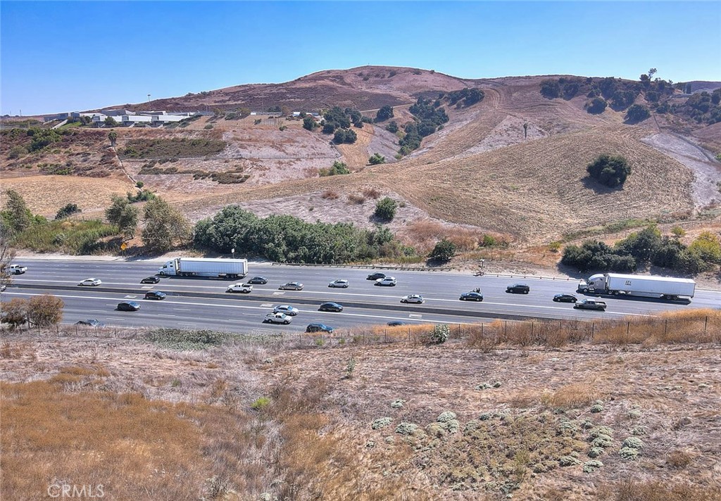 25 Franciscan Place Phillips Ranch, CA 91766 - Photo 10 of 21 a view of a dry field with mountains in the background