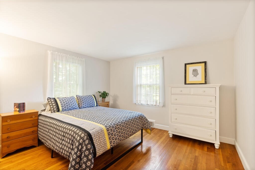 24 Blake Road Lexington, MA 02420 - Photo 11 of 30 a bedroom with a bed and a dresser