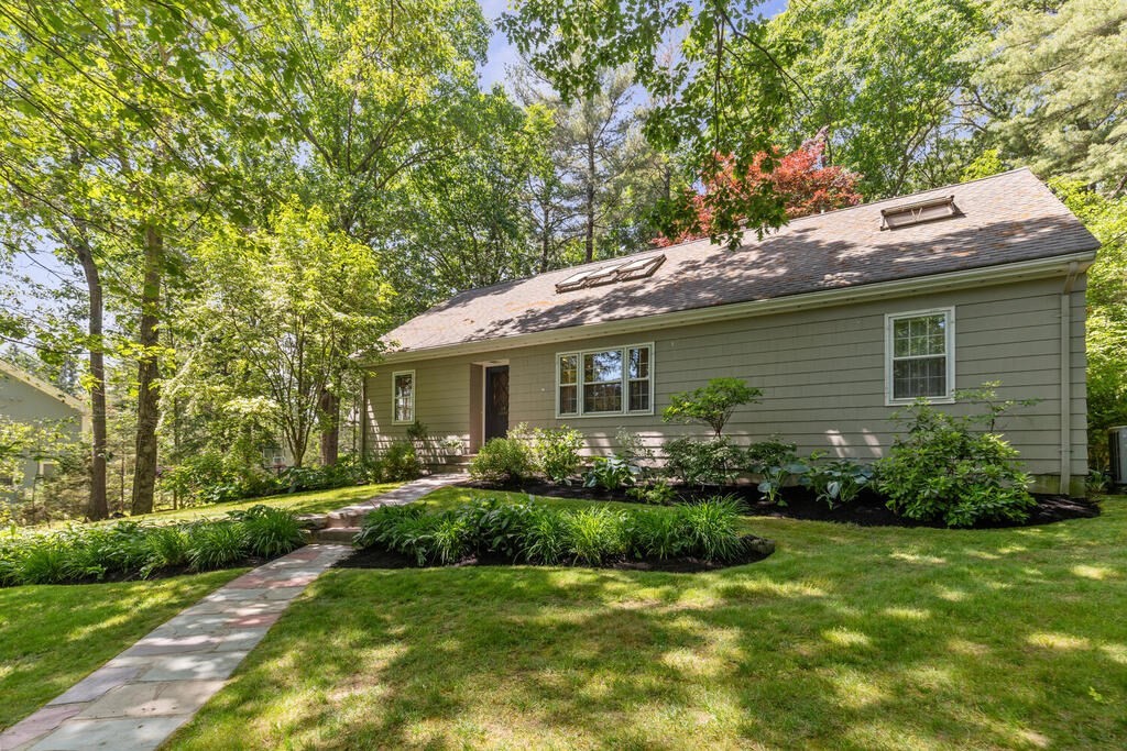 24 Blake Road Lexington, MA 02420 - Photo 2 of 30 a view of a house with a yard and potted plants