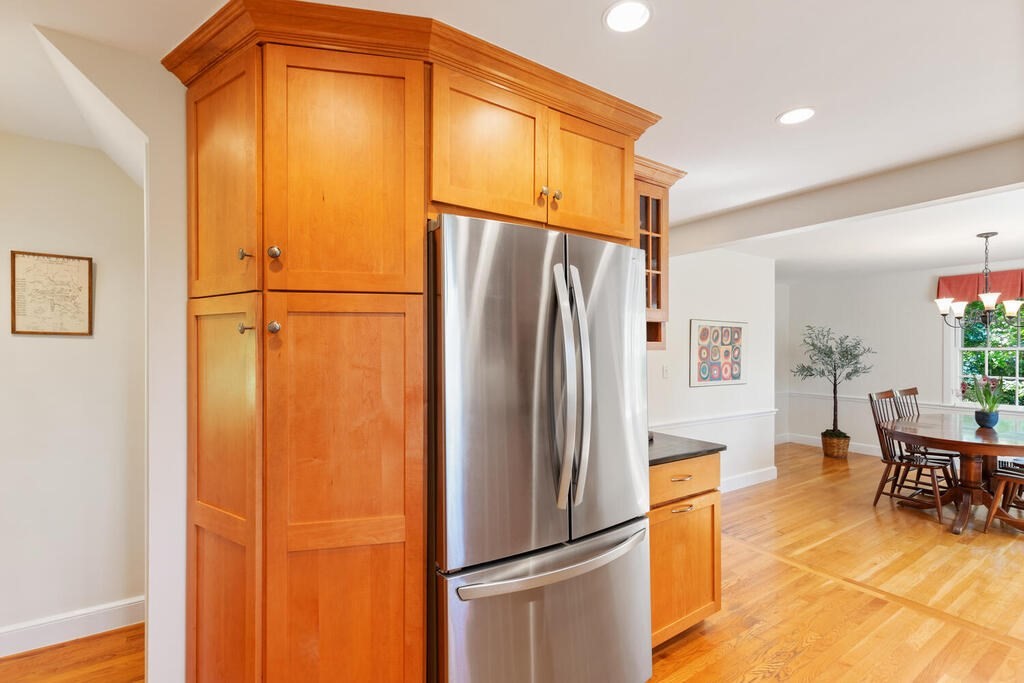 24 Blake Road Lexington, MA 02420 - Photo 22 of 30 a metallic refrigerator freezer sitting in a kitchen