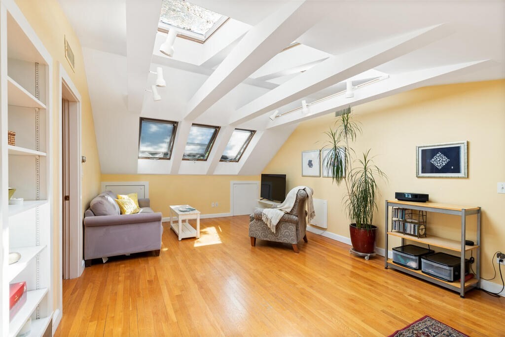 24 Blake Road Lexington, MA 02420 - Photo 24 of 30 a living room with furniture and a flat screen tv