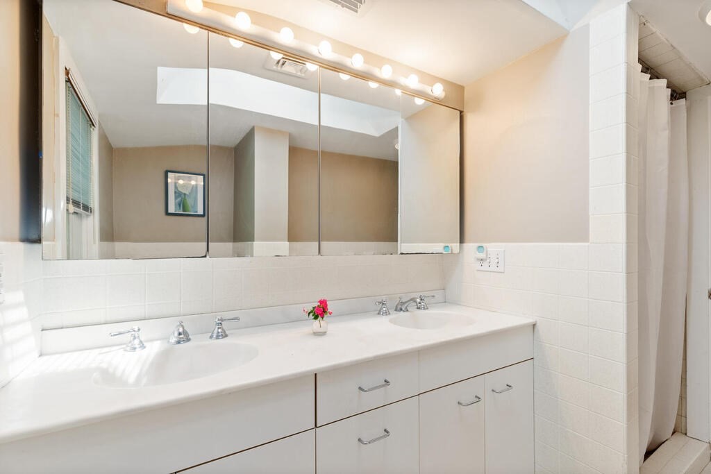 24 Blake Road Lexington, MA 02420 - Photo 25 of 30 a bathroom with a sink and a mirror