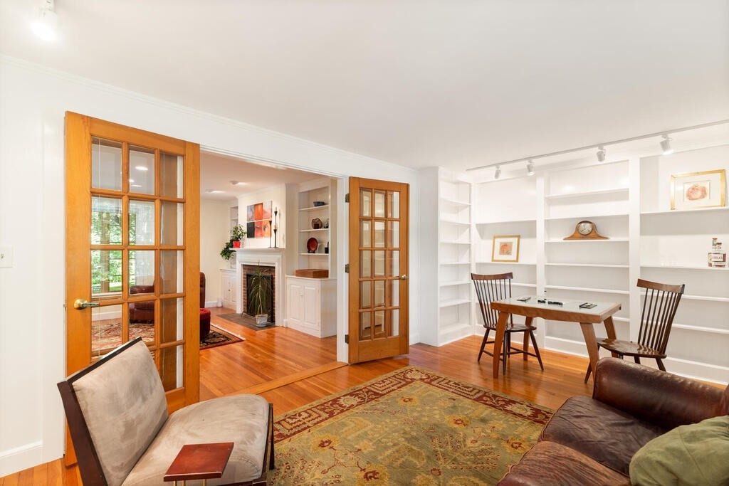 24 Blake Road Lexington, MA 02420 - Photo 10 of 30 a living room with furniture a dining table and chairs with wooden floor