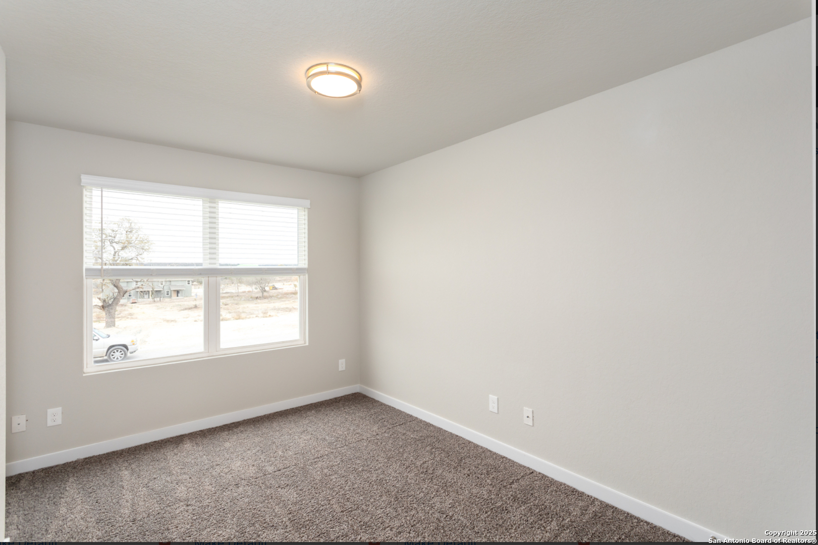 380 Abigail Alley San Antonio, TX 78253 - Photo 15 of 22 an empty room with a window
