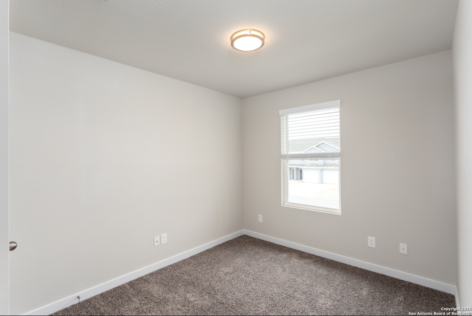 380 Abigail Alley San Antonio, TX 78253 - Photo 17 of 22 an empty room with a window