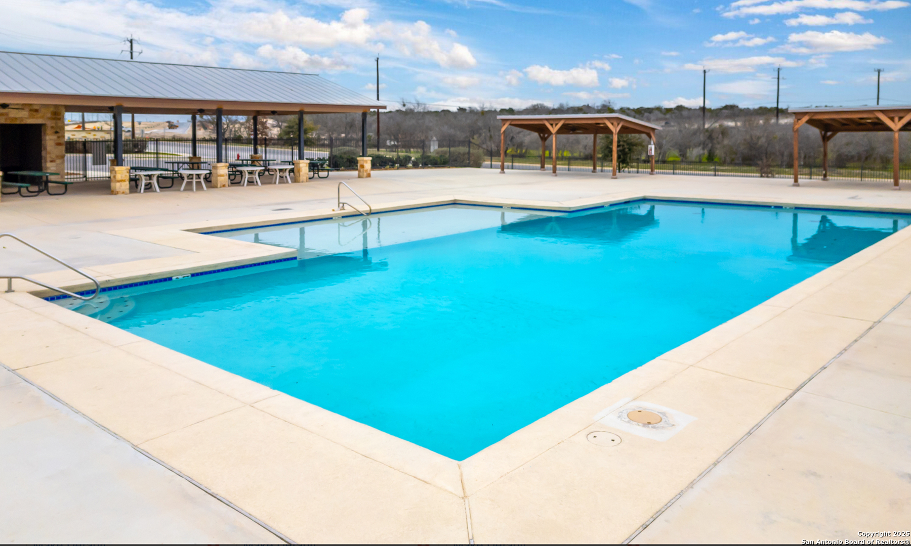 380 Abigail Alley San Antonio, TX 78253 - Photo 21 of 22 a view of a swimming pool with a lounge chair