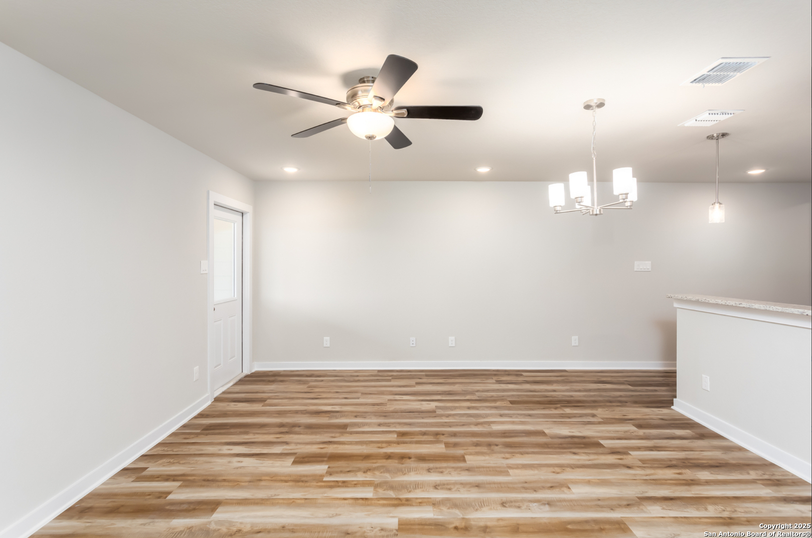 380 Abigail Alley San Antonio, TX 78253 - Photo 4 of 22 a view of a room with wooden floor and fan