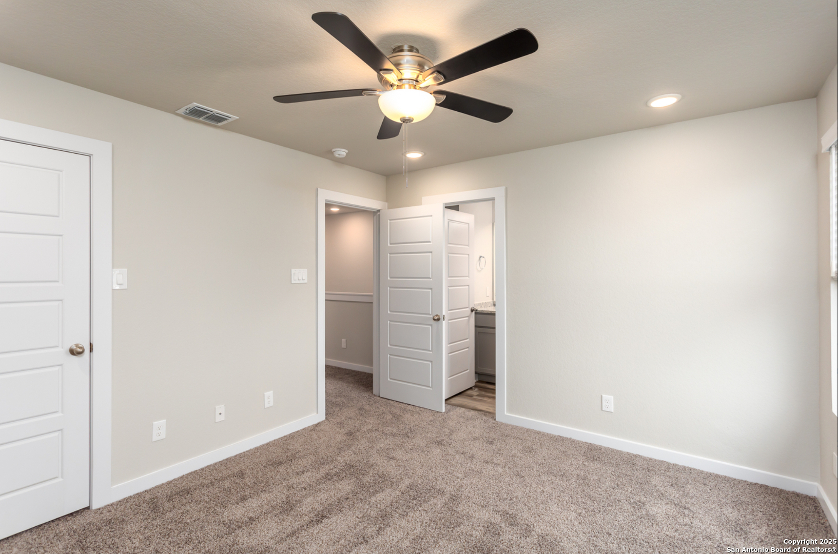 380 Abigail Alley San Antonio, TX 78253 - Photo 10 of 22 an empty room with closet and ceiling fan