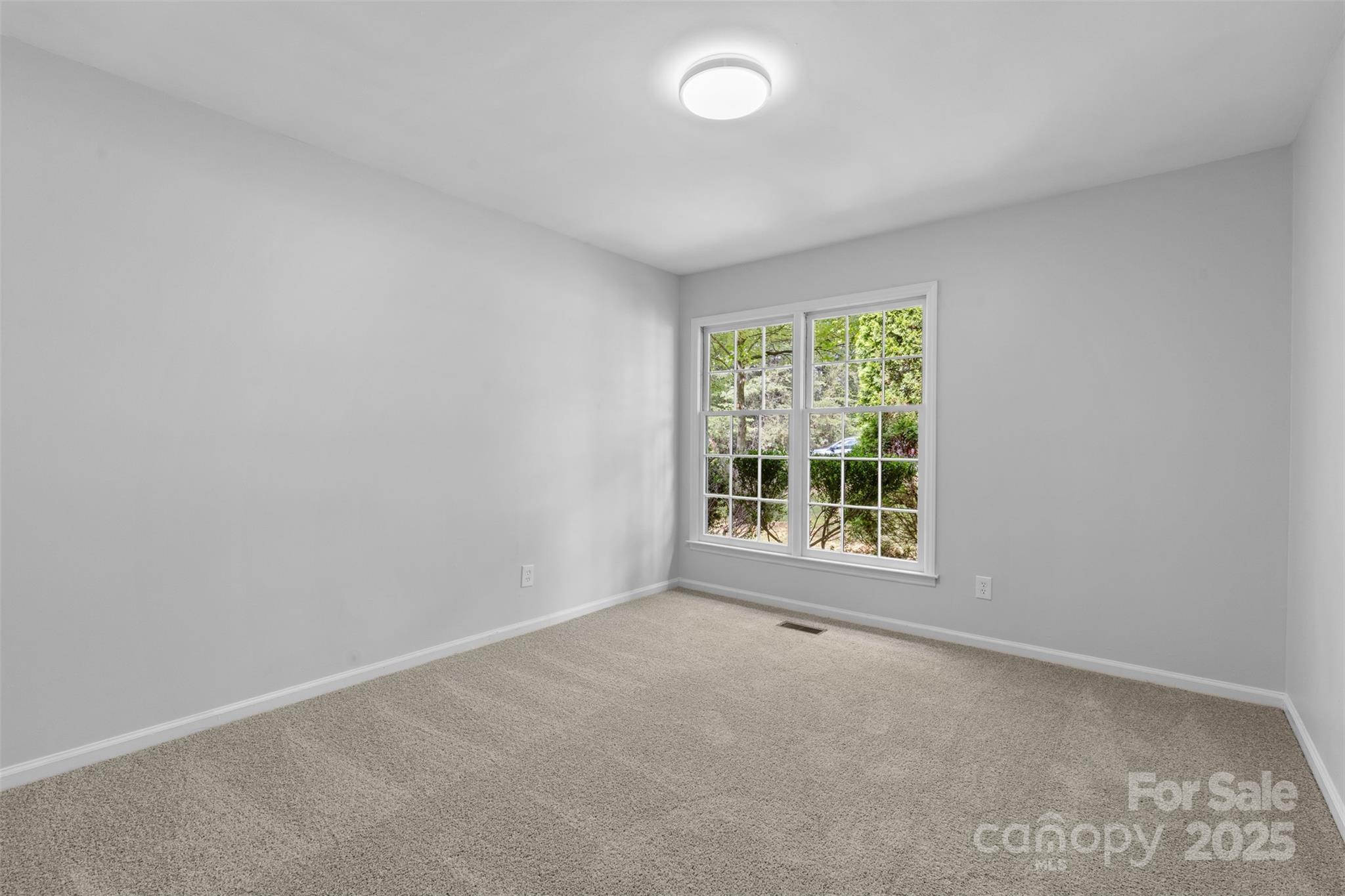 6412 Sullins Road Charlotte, NC 28214 - Photo 11 of 25 an empty room with windows