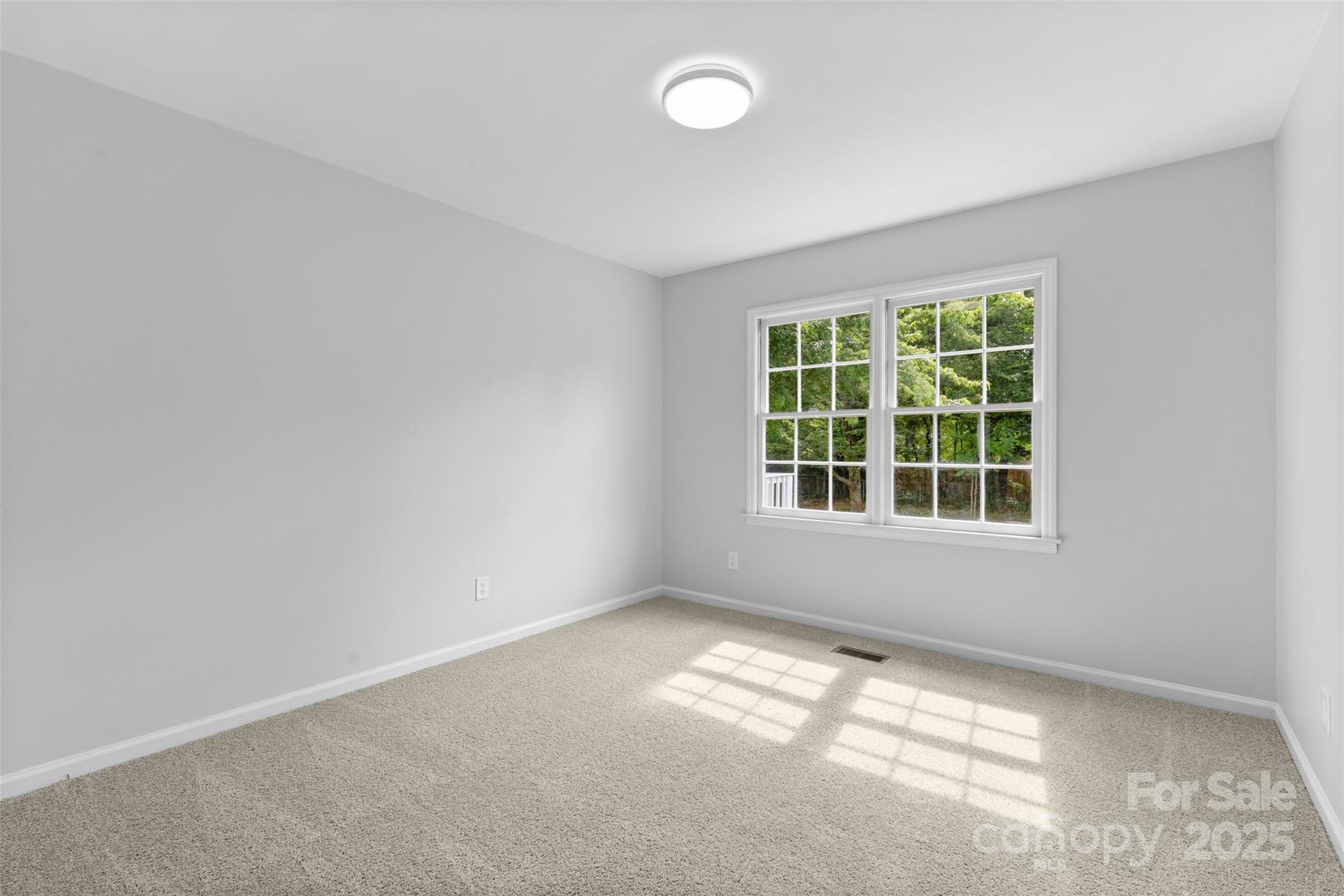 6412 Sullins Road Charlotte, NC 28214 - Photo 13 of 25 an empty room with a window