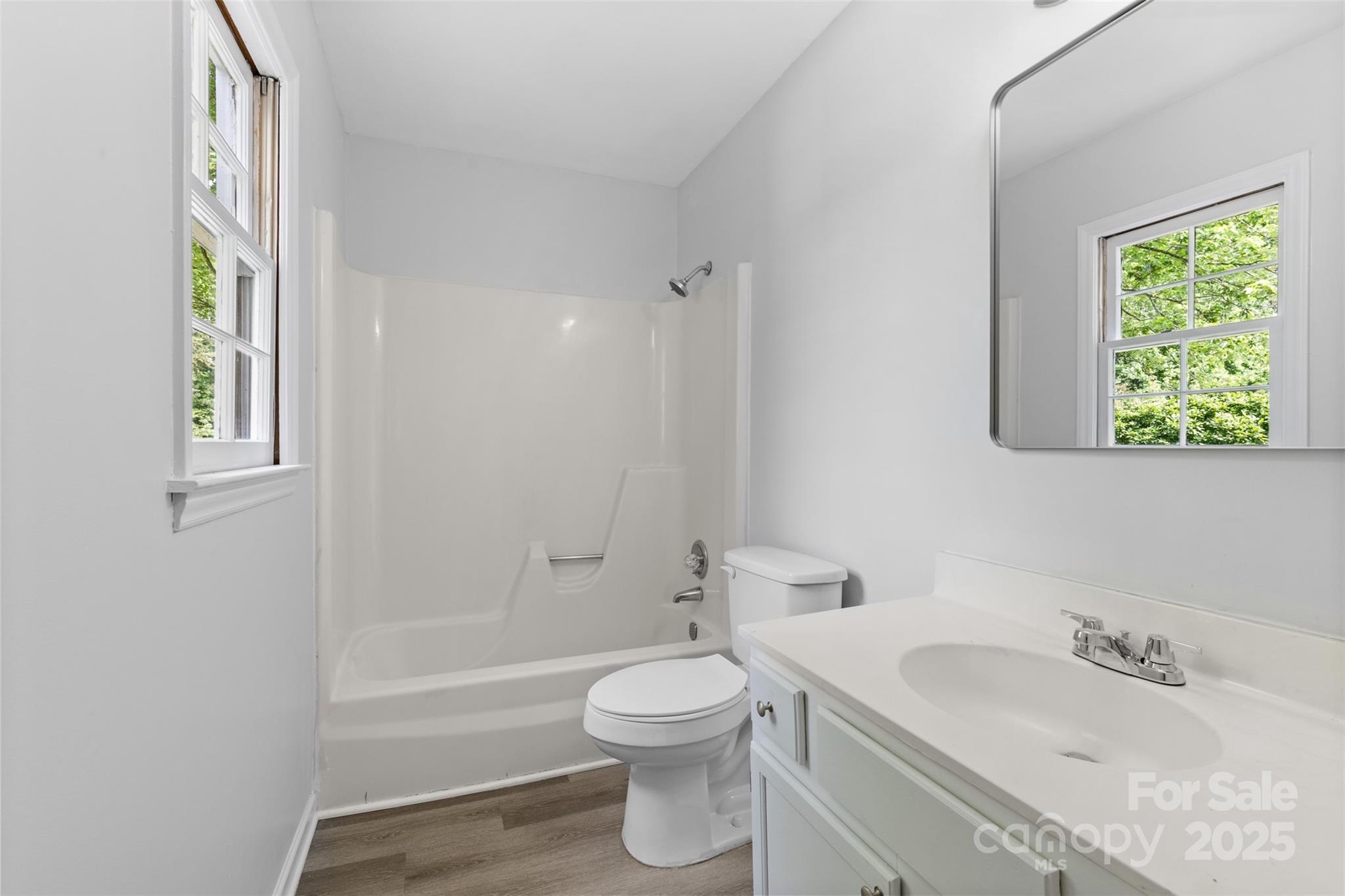 6412 Sullins Road Charlotte, NC 28214 - Photo 15 of 25 a bathroom with a toilet a sink and a bathtub