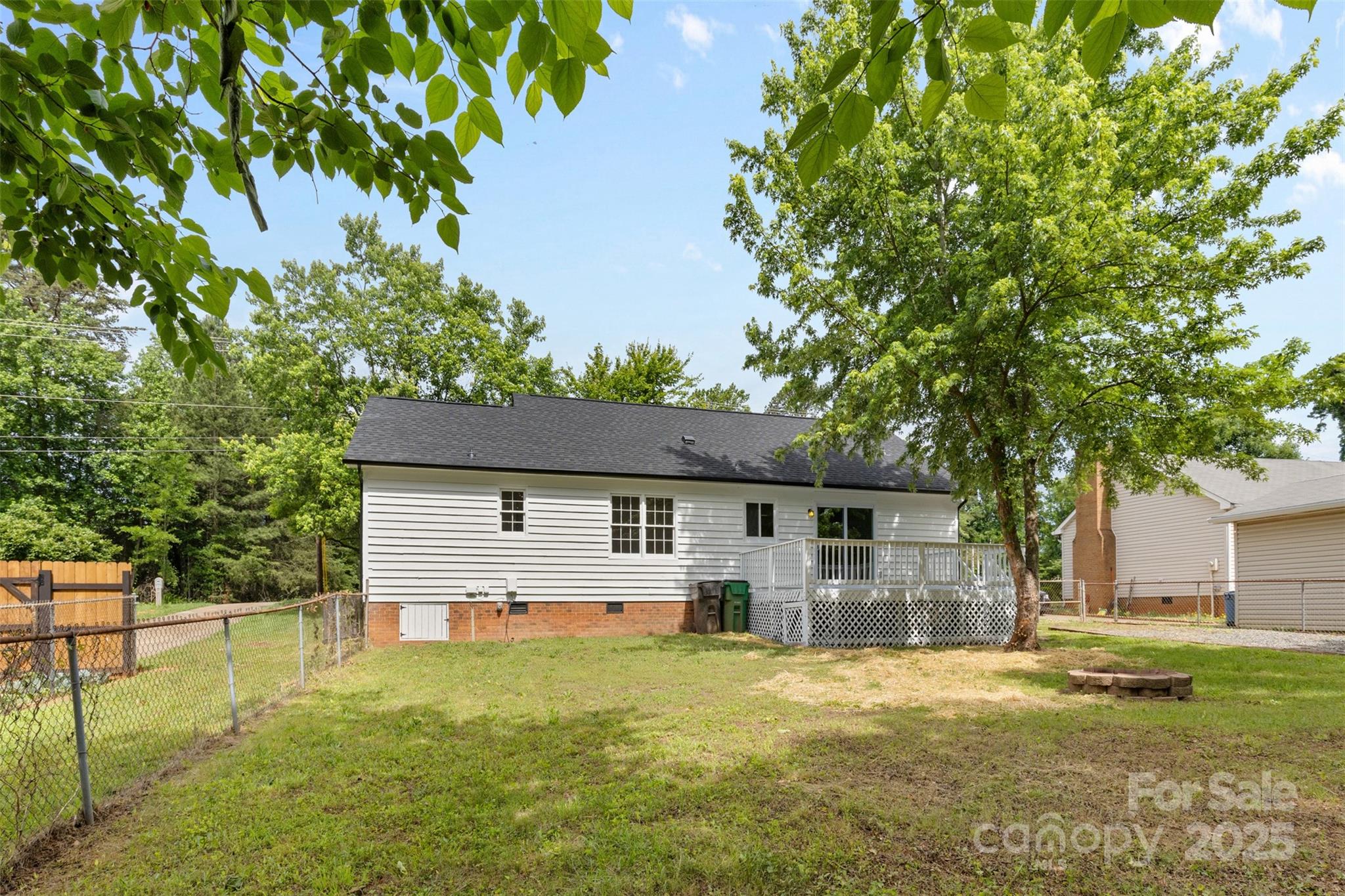 6412 Sullins Road Charlotte, NC 28214 - Photo 24 of 25 a front view of house with yard and trees in the background