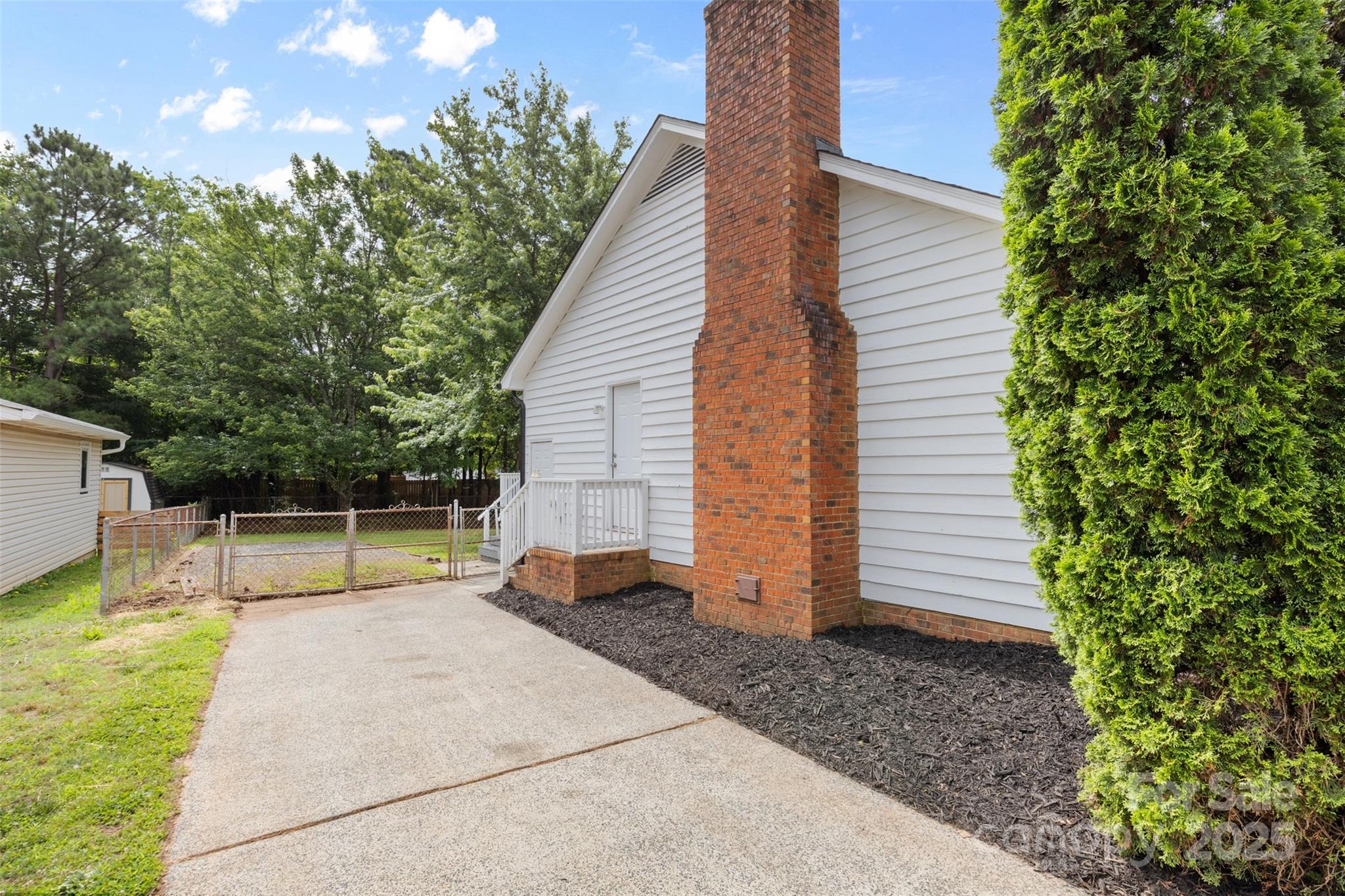 6412 Sullins Road Charlotte, NC 28214 - Photo 25 of 25 a view of backyard with swimming pool and seating space