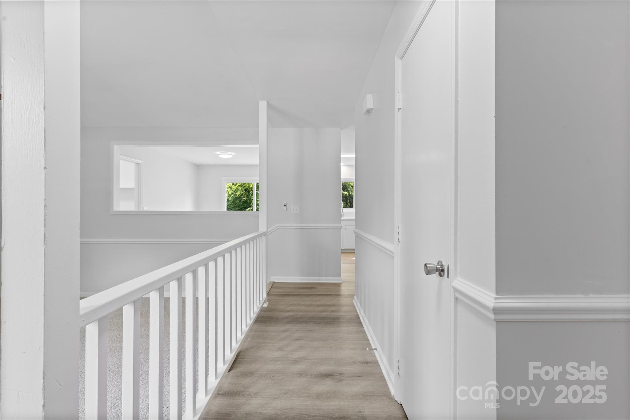 6412 Sullins Road Charlotte, NC 28214 - Photo 3 of 25 a view of a hallway view with wooden floor and staircase