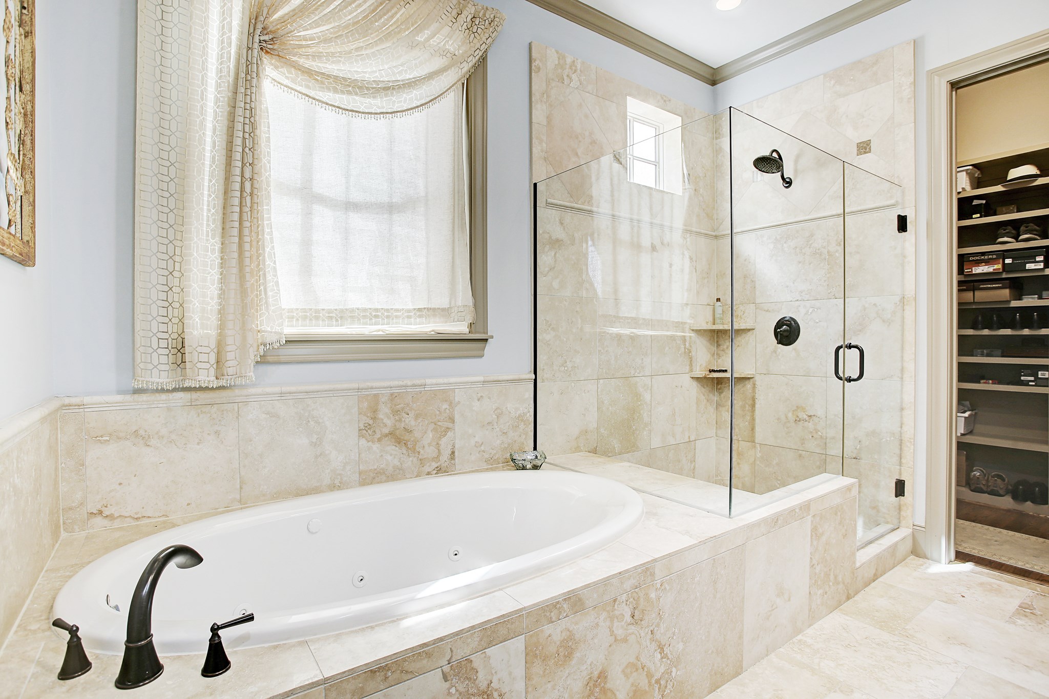 1307 Rosedale Street Houston, TX 77004 - Photo 18 of 32 a bathroom with a tub and a shower
