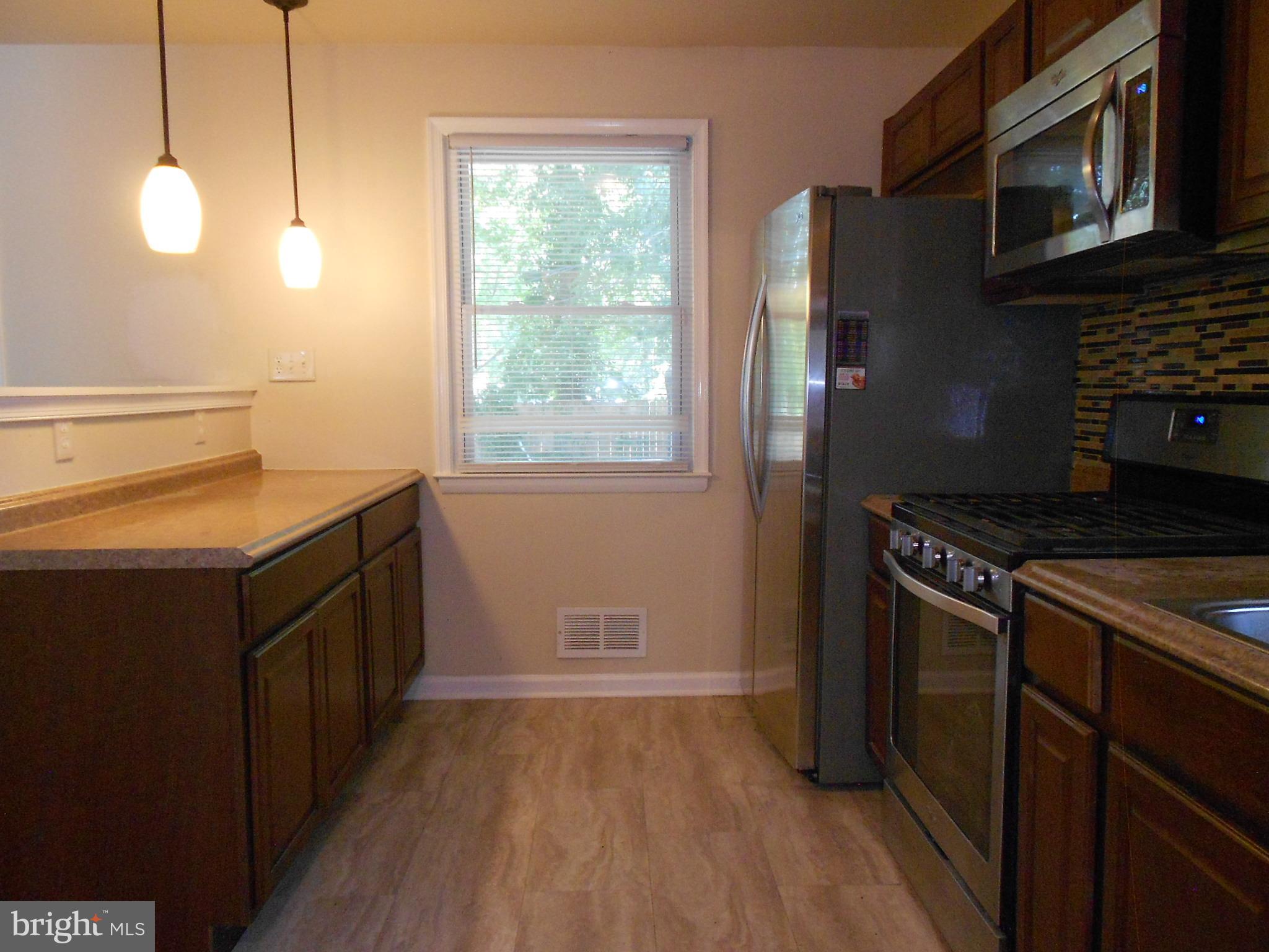 5724 Van Dyke Road Baltimore, MD 21206 - Photo 11 of 35 Pendant Lighting & Trendy New Vinyl Floor