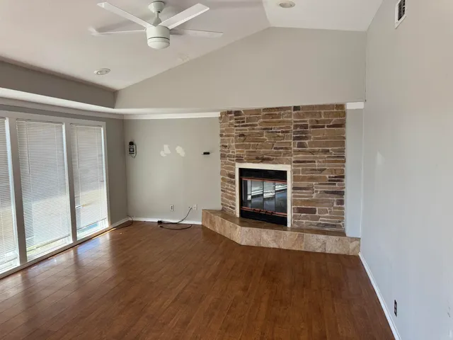 a kitchen with stove and cabinets