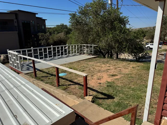 a view of a balcony with an outdoor space